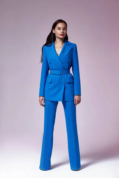 Beautiful sexy woman wear for meeting date business style suit jacket pants hand bag accessory fashion collection shoes model pose long brunette hair natural make up businesswoman casual clothes.