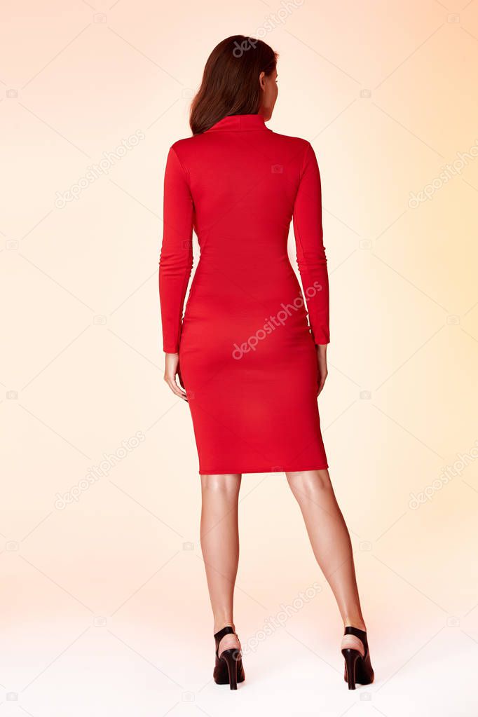 Woman model fashion style red skinny dress beautiful secretary diplomatic protocol office uniform stewardess air hostess business lady perfect body shape brunette hair wear suit elegance casual.
