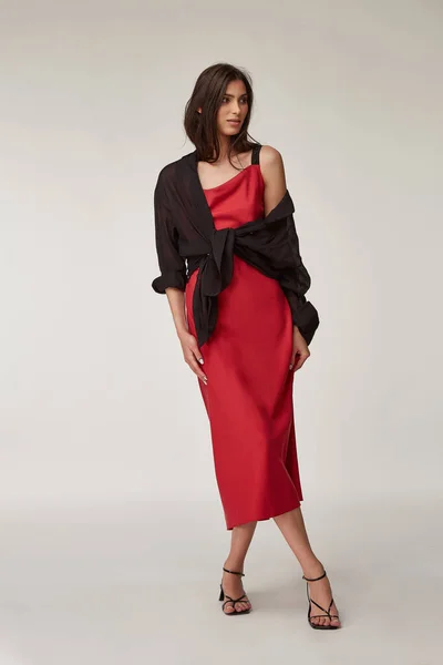 Fashion pretty woman beautiful makeup perfect body shape tanned skin wear clothes summer collection organic textile black cotton shirt, red silk dress stylish sandals shoes, accessory casual romantic.