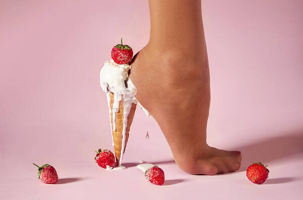 Nylons, stay-up, tights, hosiery, hose, pantyhose socks summer collection on pink background as a heel creative dessert ice cream with berry strawberry.