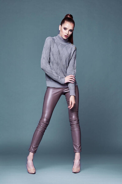 Beautiful sexy pretty woman perfect body shape face makeup wear lilac wool cashmere sweater and skinny lather pants shoes accessory casual clothes for party walk brunette hair fashion style.