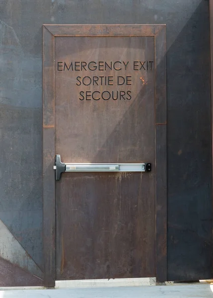 Rusted Steel Exit Door English French — Stock Photo, Image