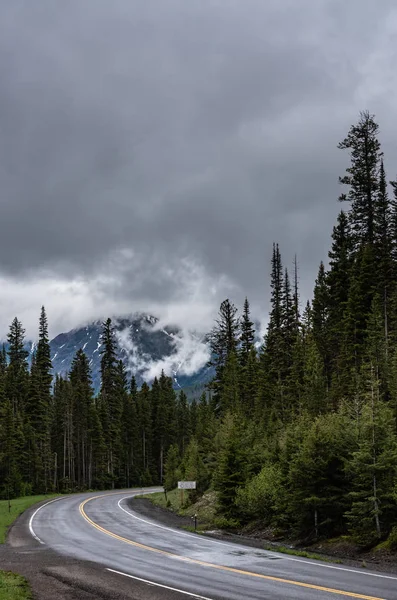 Curve in Road on Rainy Day in Wyoming mountains