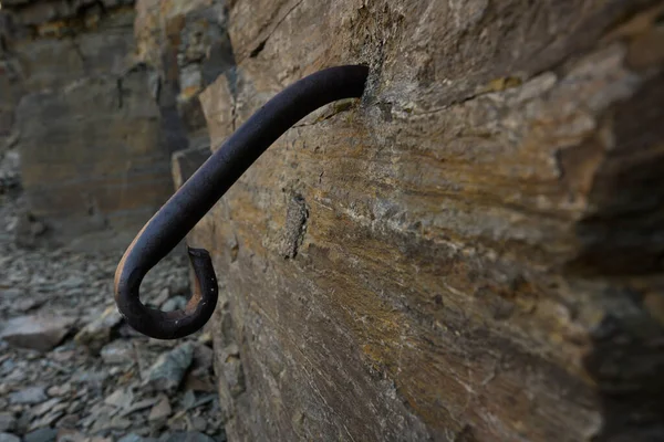 Iron Loop In Rock Wall for securing rope