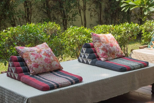 The mattresses and cushions are in Thai style and place for relaxing outside the house.