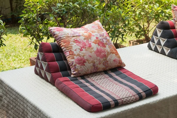 The mattresses and cushions are in Thai style and place for relaxing outside the house.