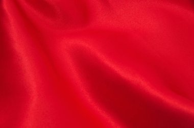 Arkaplan olarak kırmızı saten veya ipek kumaş