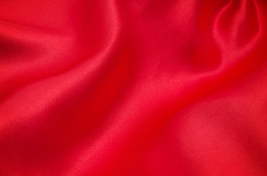 Arkaplan olarak kırmızı saten veya ipek kumaş