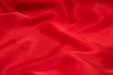 Arkaplan olarak kırmızı saten veya ipek kumaş