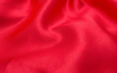 Arkaplan olarak kırmızı saten veya ipek kumaş