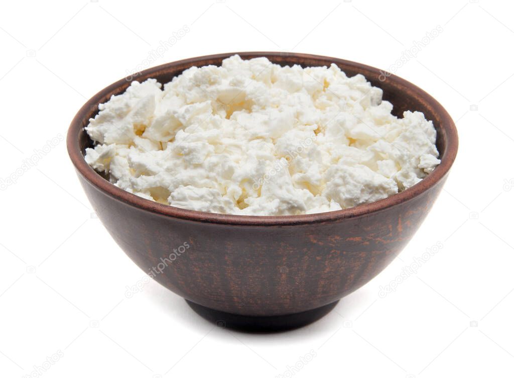 Freshly grained homemade cottage cheese, isolated on white background.