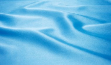 Pürüzsüz mavi ipek arka plan olarak kullanılabilir