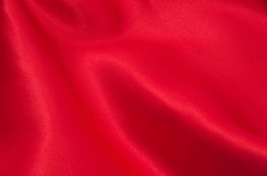 Arkaplan olarak kırmızı saten veya ipek kumaş