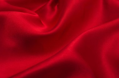Arkaplan olarak kırmızı saten veya ipek kumaş
