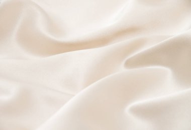 Arkaplan olarak beyaz saten kumaşı yakın plan