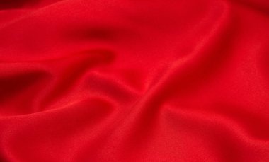Arkaplan olarak kırmızı saten veya ipek kumaş