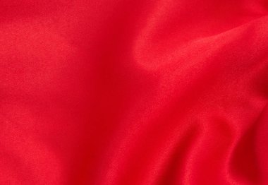 Arkaplan olarak kırmızı saten veya ipek kumaş