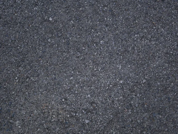 Pürüzsüz asfalt yolu. Asfaltın dokusu, üst görünüm