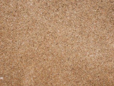 Kahverengi küçük taş duvar dokusu arka plan, zemin taşla yıkanmış, küçük kum taşından yapılmış.