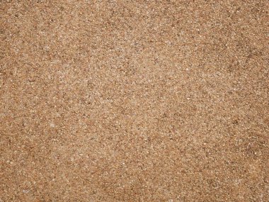 Kahverengi küçük taş duvar dokusu arka plan, zemin taşla yıkanmış, küçük kum taşından yapılmış.