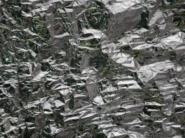 Gümüş pürüzlü folyo dokusu. Alüminyum folyo doku arka planı. metal plaka