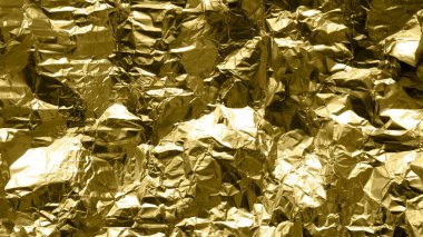Doku arkaplanı için parlak buruşuk yüzeyi olan altın folyo arka plan