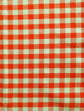 Kırmızı ve beyaz kareli kumaş arkaplanı.