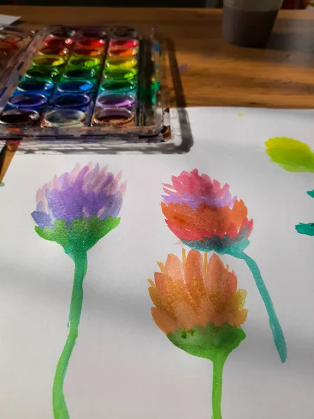 Painted flowers and paints set.