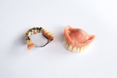 closeup of dental prosthesis on a white background clipart