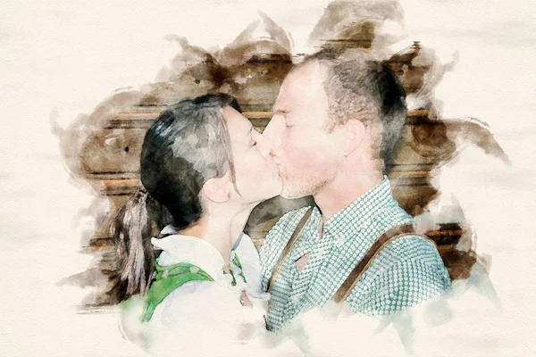 Couple dans les vêtements bavarois traditionnels s'embrassent — Photo