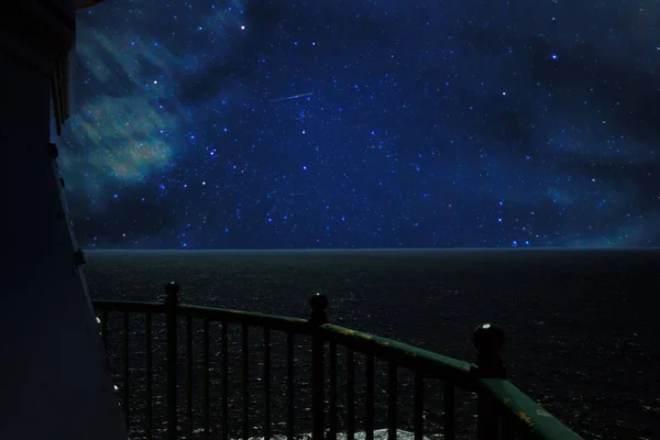 View from lighthouse to the ocean on a starry night — Stock Photo, Image
