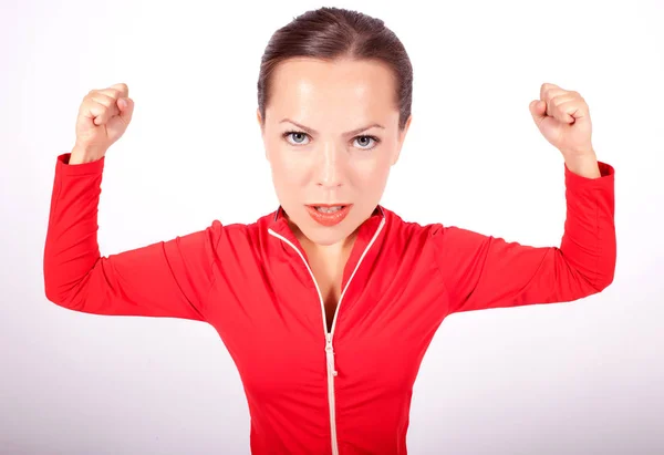 Young woman with big head flexing her muscles — Stock Photo, Image