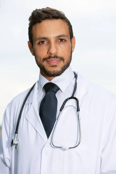 Handsome doctor in white coat with stethoscope — Stock Photo, Image