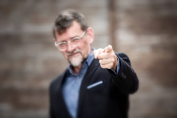 Handsome businessman pointing his finger to the camera — Stock Photo, Image