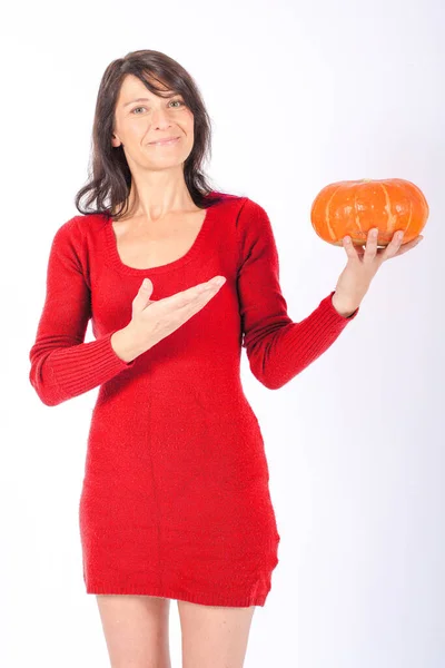 Young Brunette Woman Red Dress Standing Holding Pumpkin White Background — Stock Photo, Image