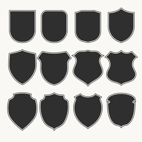 Heraldic shields icons set silhouettes. Vector illustration — Stock Vector