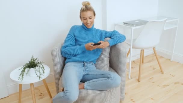 Young Woman Using Smartphone Home — Stock Video
