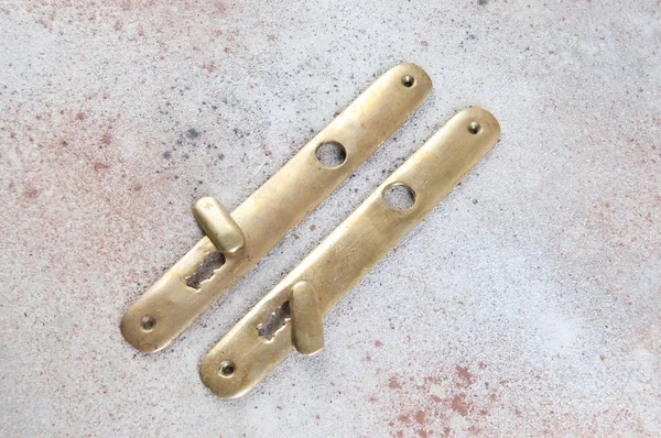 Vintage Brass Key Handle Holes Cover Concrete Background Copy Space — Stock Photo, Image