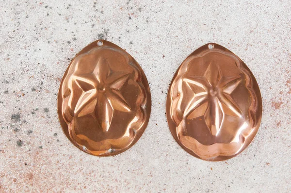 Vintage copper cookie molds on a concrete background. Copy space for text