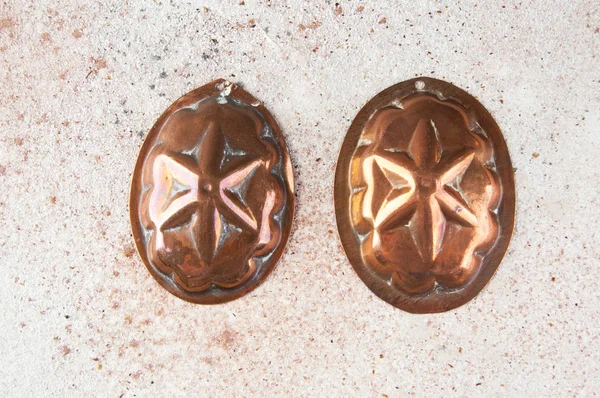 Vintage copper cookie molds on a concrete background. Copy space for text