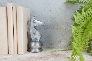 Antique book end on concrete background clipart