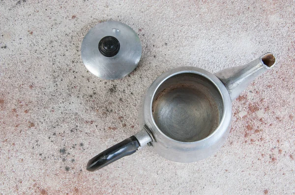 Silver metal tea pot on concrete background. — Stock Photo, Image