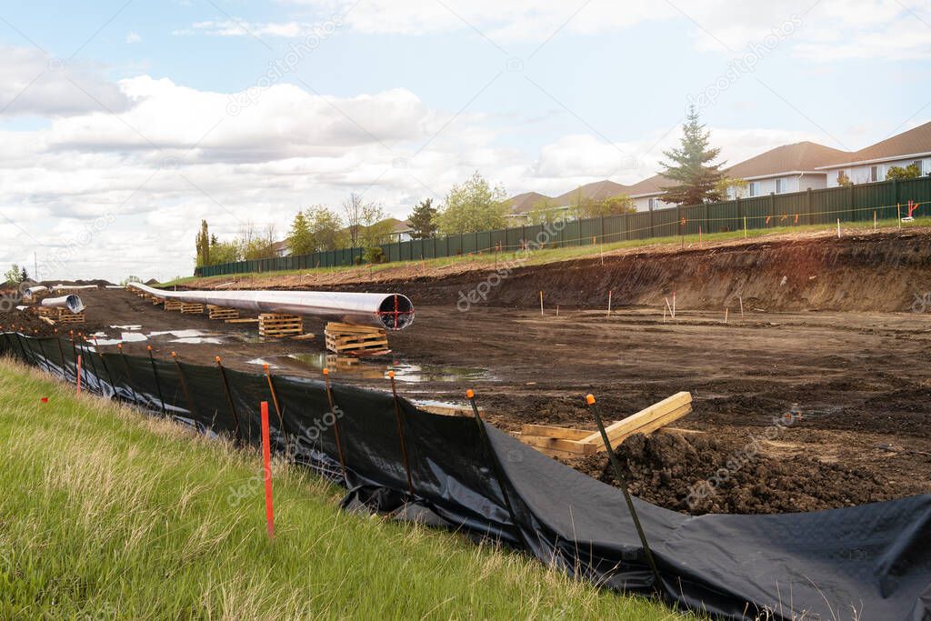 Construction of Oil and Gas pipeline in a city. Welding. Trans mountain pipeline in Canada.