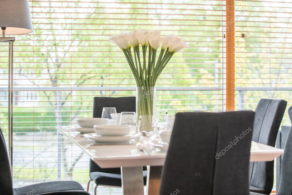 White flower on a table in a living room