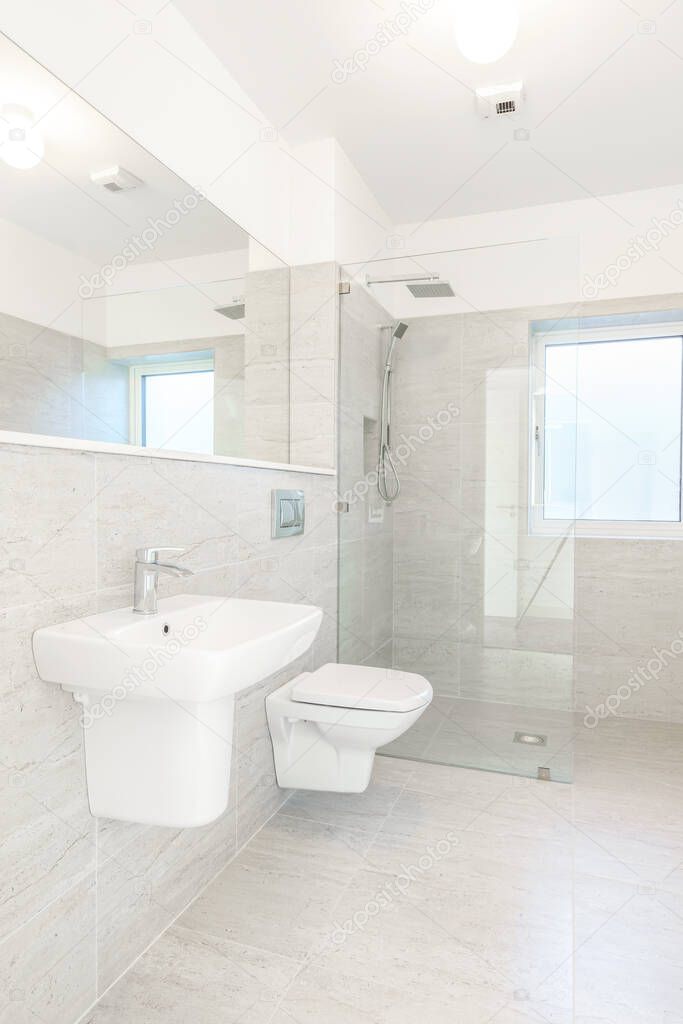 Bright nice modern bathroom with shower cabin