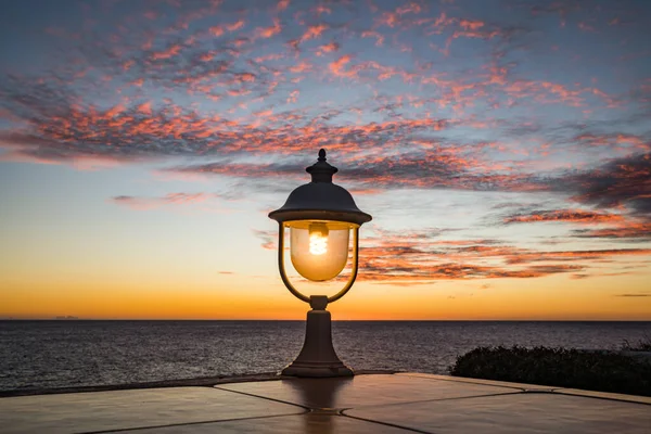 A lamp in the Sunset views over the Caribbean sea off Curacao
