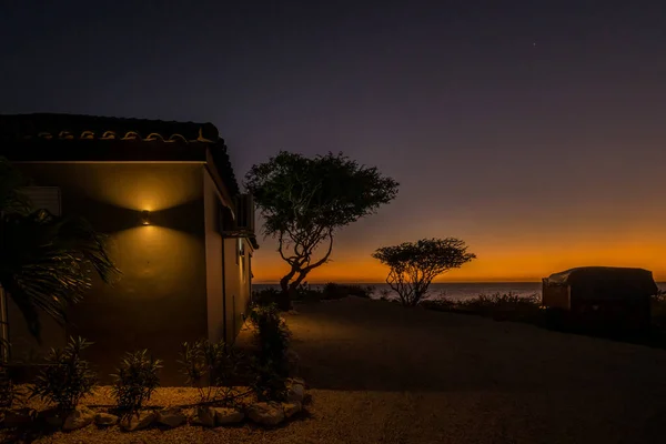 view of the moon and the sun in the desert