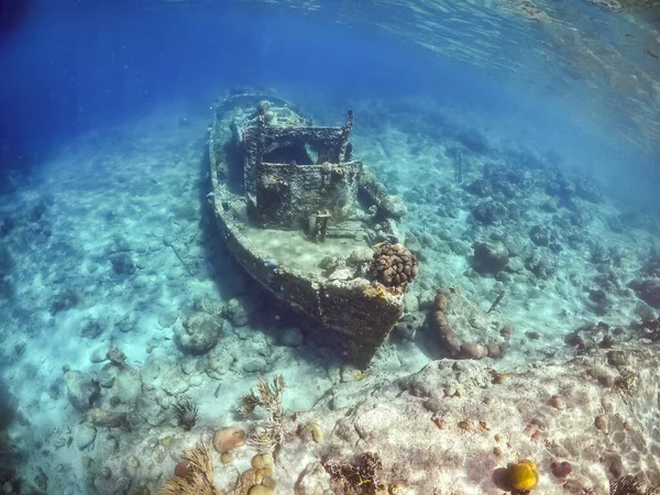 Drowned rusted boat deep on the sea bottom. Underwater footage