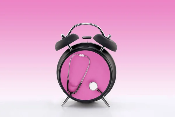 Time for medical check-up. Conceptual. Stethoscope inside an alarm clock.