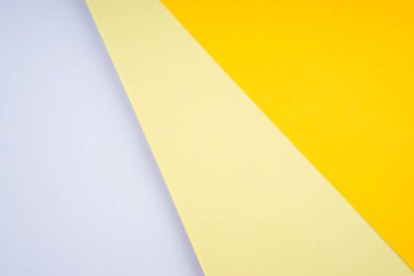 Yumuşak pastel renkli kağıtların yaratıcı düzenlemesi soyut bir arkaplan oluşturuyor